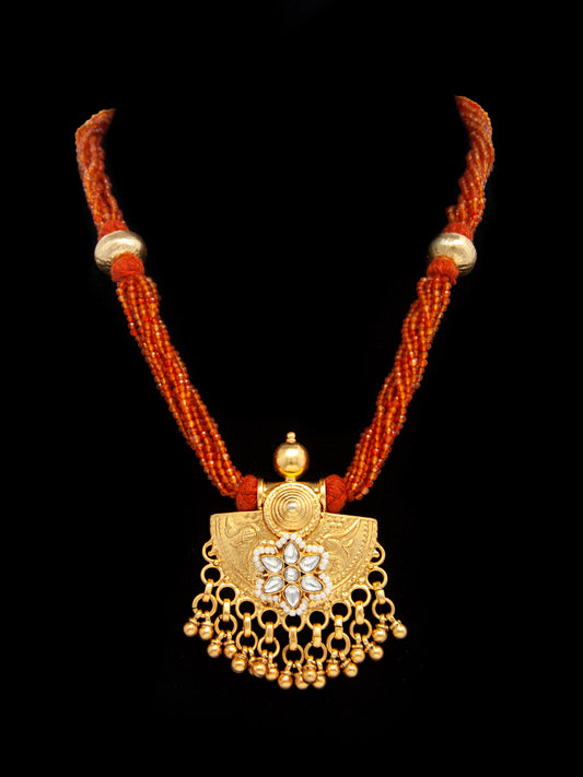 Golden Ghungroo Fusion: 925 Silver Gold Plated Pendant with Tribal Ghungroo, Floral Kundan Motif, and Orange Carnelian Gemstone Beads