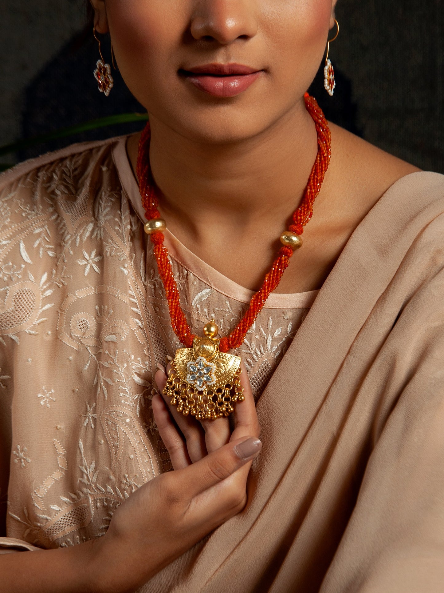 Golden Ghungroo Fusion: 925 Silver Gold Plated Pendant with Tribal Ghungroo, Floral Kundan Motif, and Orange Carnelian Gemstone Beads